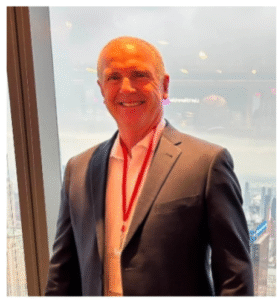 man in suit with lanyard
